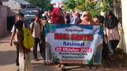 Kades Wandi Ajak Anak-Anak SD di Jomin Timur Gelar Jalan Santai Peringati Hari Santri 2025